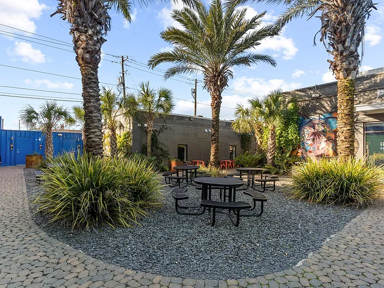 And here's where you emerge into your private courtyard. WiFi, flowers, street art. Who needs more?