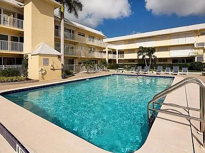View of unit from pool (behind V palm tree set in back)