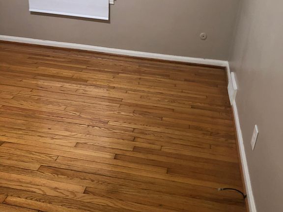 Wood floors in living room dining room and three bedrooms newly refinished