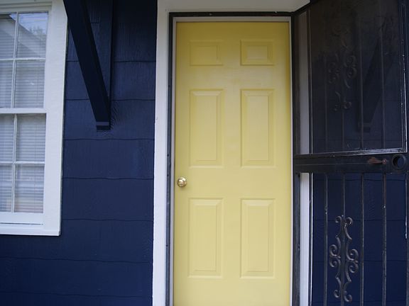 Close-up of the front entrance door, highlighting the entry area and front porch details.