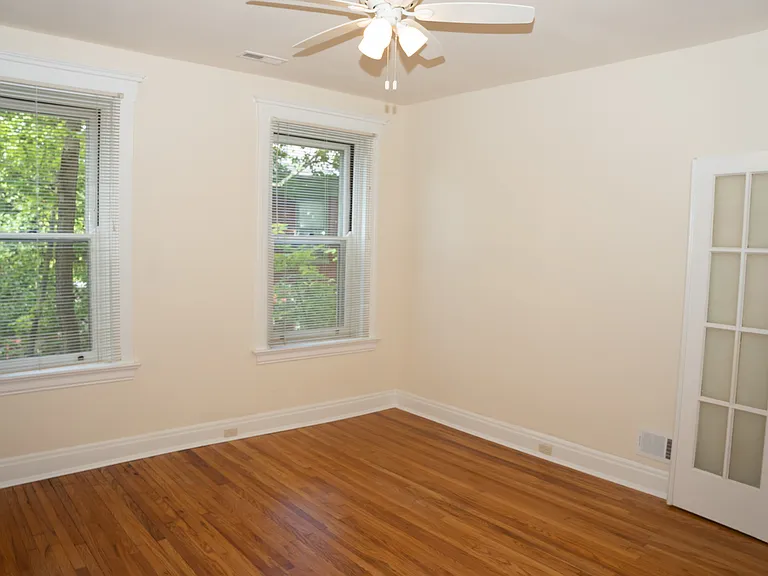 The primary bedroom has double doors and a secondary door as well.