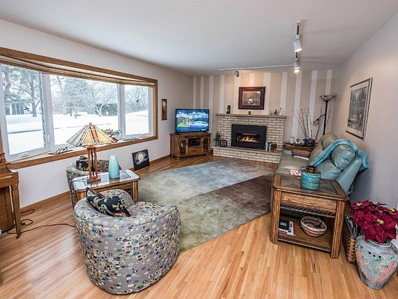 Big and bright living room with a beautiful bay window and hardwood floors.