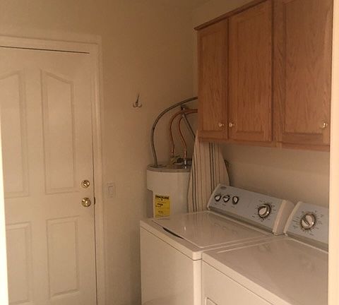 Laundry Room which leads to attached garage off kitchen.