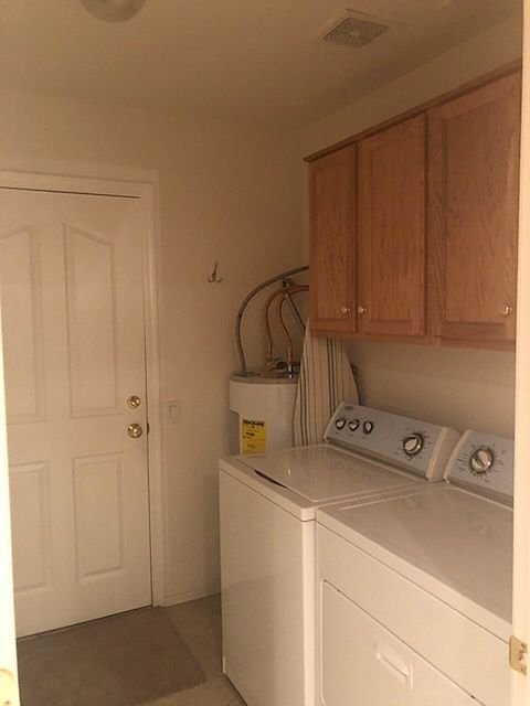 Laundry Room which leads to attached garage off kitchen.