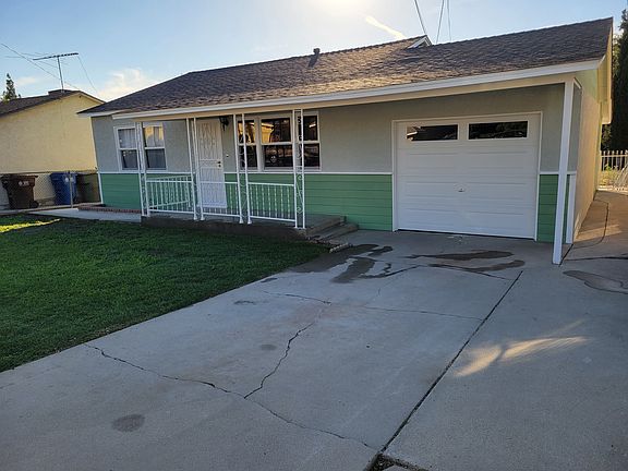 Freshly painted exterior with new garage door
