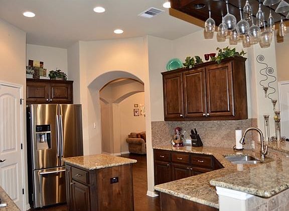 Kitchen island, lovely granite, travertine backsplash