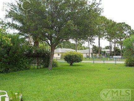 PARTIAL VIEW OF BEAUTIFULLY LANDSCAPED BACK YARD....NOTE FENCE