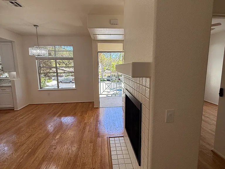 View of fireplace and front door.