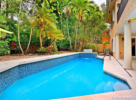 Live the Grove lifestyle in this lovely, gated home