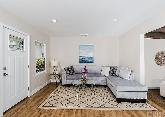 Living room open to family room and dining area.