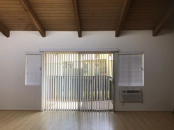 Open living area facing balcony.