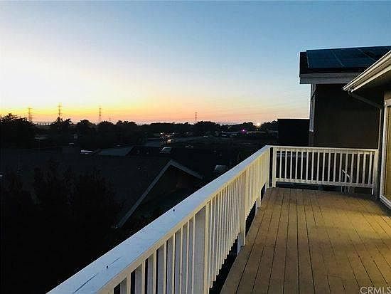 View of sunset over the ocean from balcony