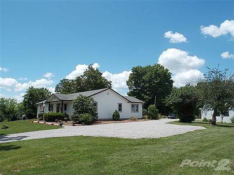 Picturesque setting with over 2 acres in heart of Florence!   Great combination of completely renovated main home with 4 bedrooms, separate cottage with 2 bedrooms, and large barn/garage with loft area.   Don't miss this one.  Rare & exceptional throughout and the land is gorgeous and flat.   Call today!   Lots of road frontage on Boone Aire.   Zoned UR-1/ one year home warranty included/ small cottage home is currently rented/ A MUST SEE!