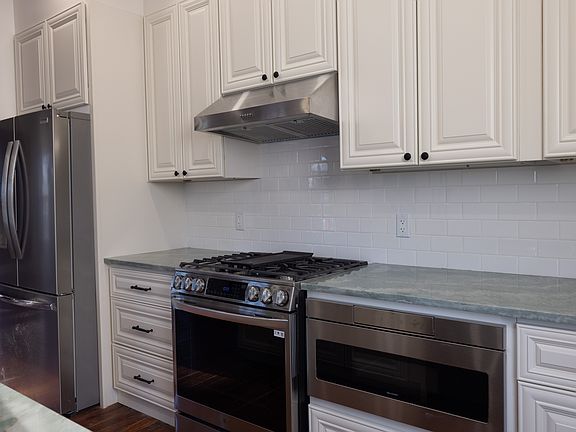 Brand new stove, refrigerator, and built in microwave