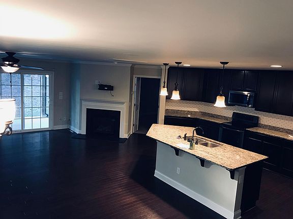 Showing fireplace and large kitchen space