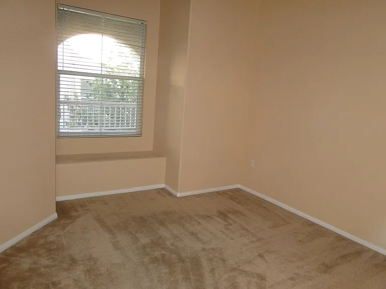 Spacious bedroom with reading nook. My favorite.