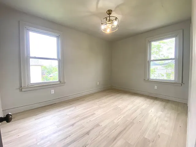 Large primary bedroom features spacious closet and private bathroom.