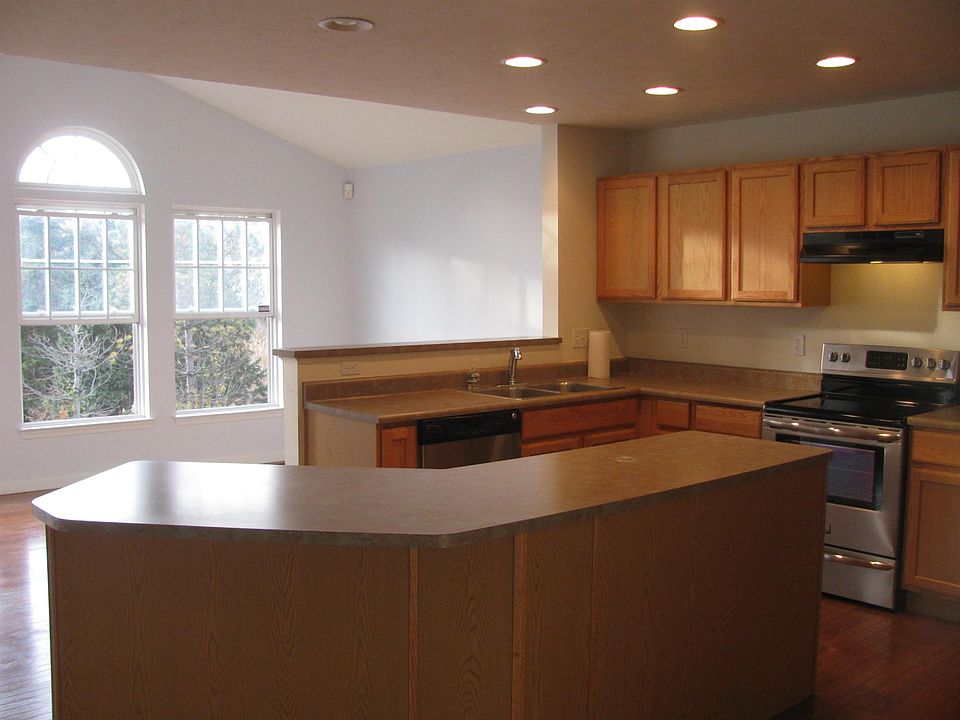 Large Open Kitchen w/center island.  Newer SS appliances.  W