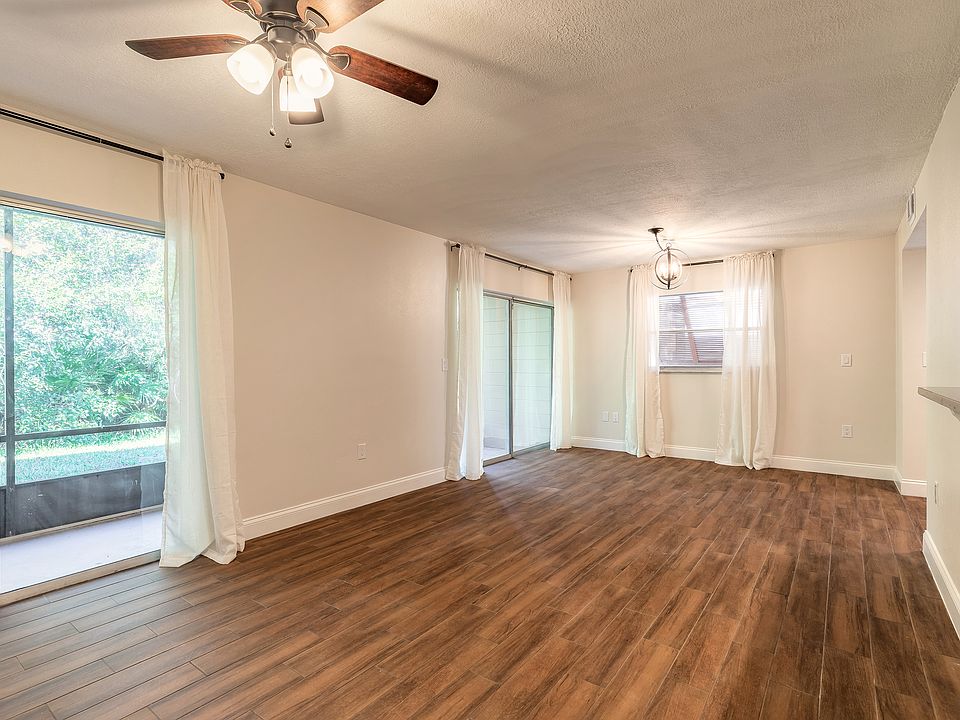 Two large sliding glass doors let ample natural light into the living area and give you access to your own private screened porch.