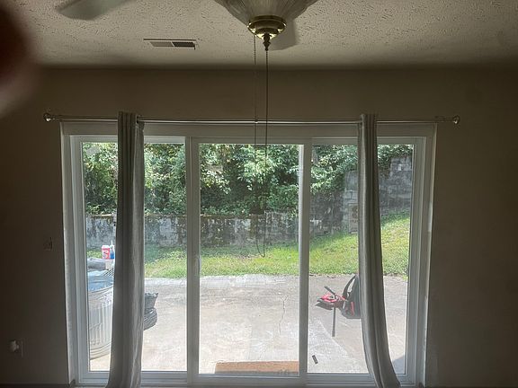 Back Patio; Large 3-Pane Sliding Door lets in a lot of Light.
