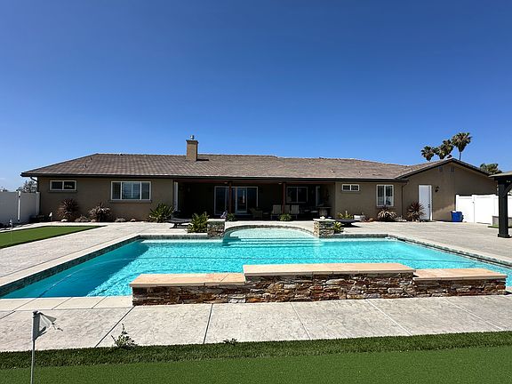 20' x 40' pool with fittings to add volleyball net, 3 water features and multi-colored lights for night swimming.