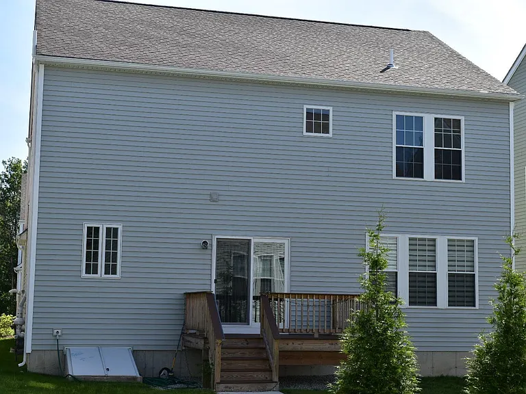 Large deck on the back connects to living room on first floor. There is also a bulkhead coming out of full basement.
