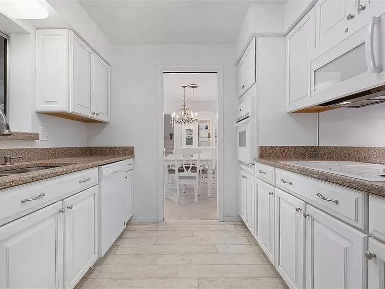 Kitchen
granite counters and white appliances