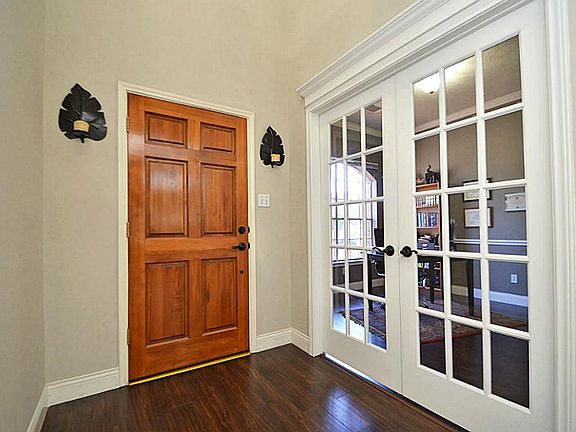 As you enter through the beautiful entry door you are greeted with beautiful Wood finish floors with Study/Dinning on the left with French Doors