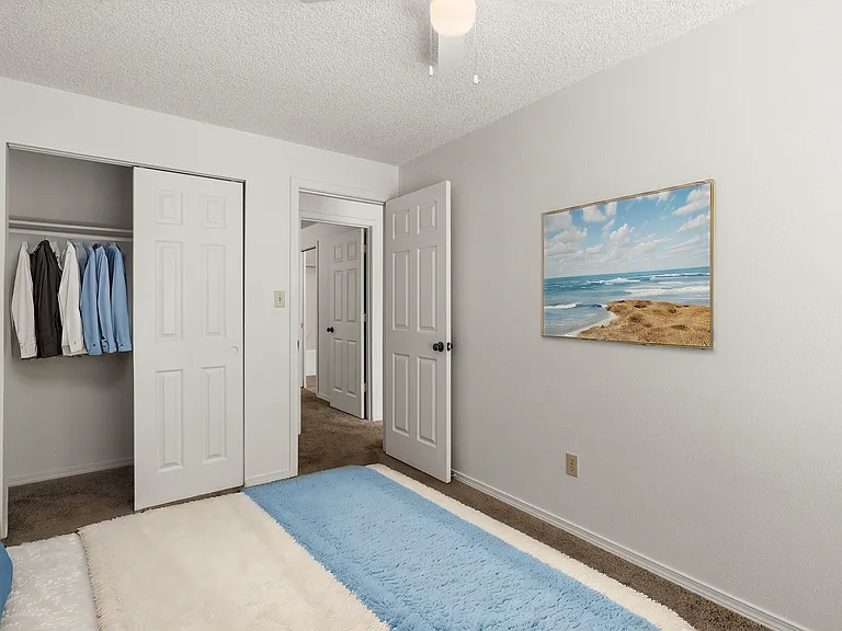 Experience tranquility in this well-lit bedroom, complete with a spacious closet and calming beach artwork. Experience tranquility in this well-lit bedroom, complete with a spacious closet and calming beach artwork.