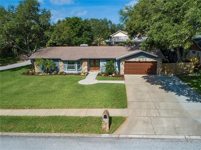 Huge over sized lot.  Plenty of privacy- windows have been replaced with double pane insulated white windows.  Newer front and garage door.  No Flood insurance and block construction.