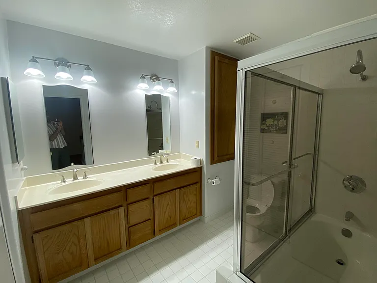 Dual sinks with laundry area upstairs.