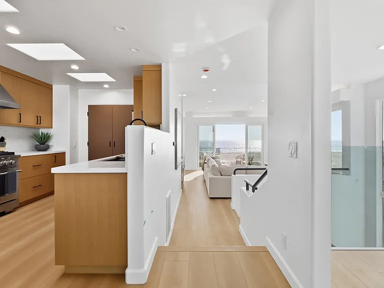 At the top of the third floor you will find a chef's kitchen with walk-in pantry, breakfast nook, 8-sit dining table, and rooftop patio with direct stair access to the street