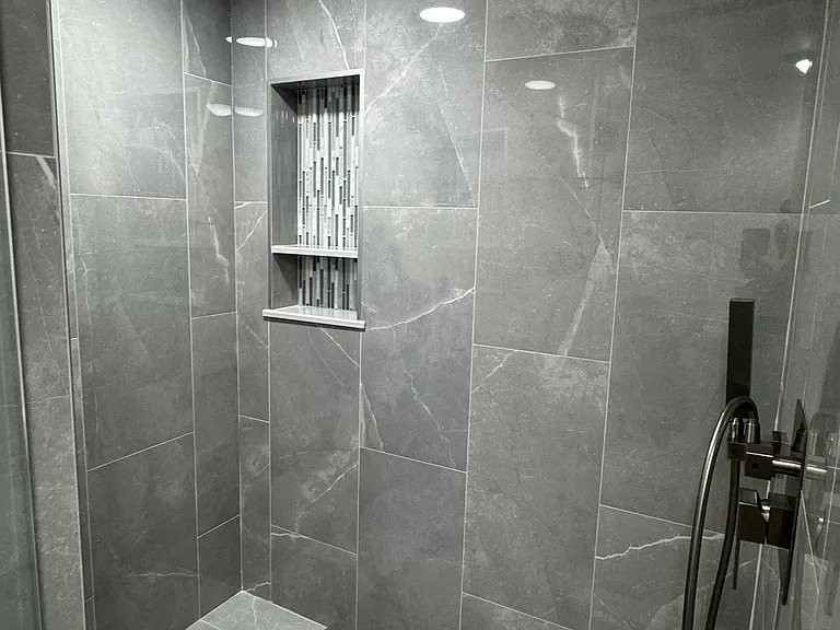 2 shelves on each side to put your soaps and shampoo bottles on . Master bathroom