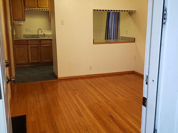 Living room, doorway to kitchen.