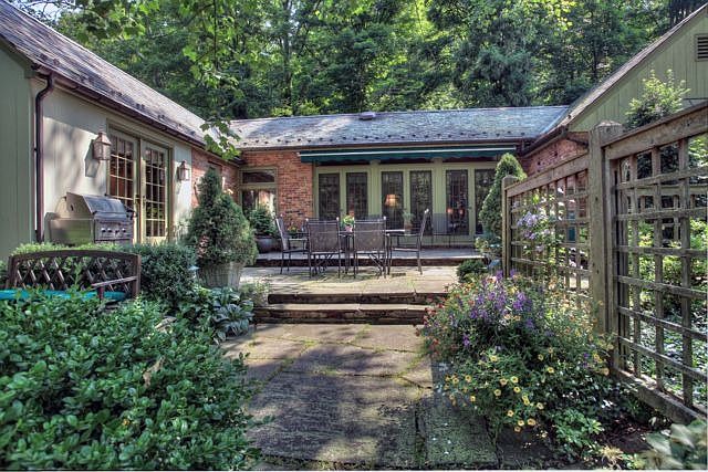 TERRACE ENHANCED BY SLATE ROOF AND BRICK EXTERIOR
