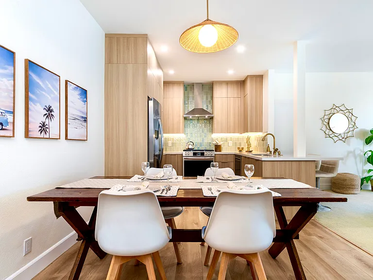The dining area flows to the kitchen and living room.