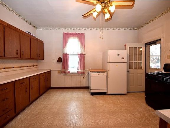APPLIANCES INCLUDE A REFRIGERATOR, DISHWASHER, AND ELECTRIC STOVE