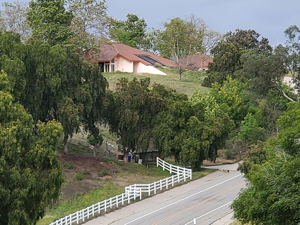 View of the house from the street. House is located on almost 5 acres