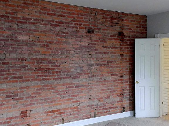 Example of exposed brick wall in the living room