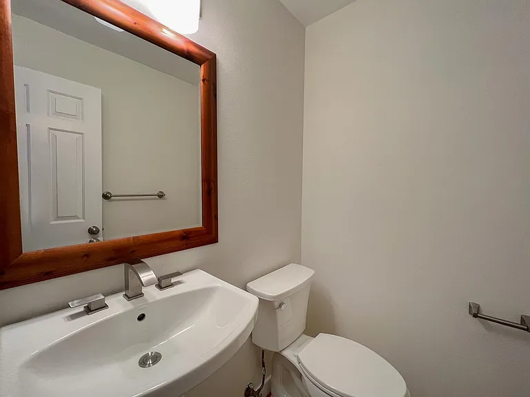 Main floor Powder room with brand new Toilet, Pedestal sink, Fixtures and Medicine Cabinet
