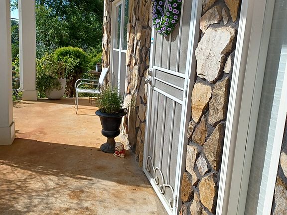 Covered front porch with sitting area. Safe for Amazon package delivery