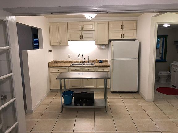 Nice steel work table in the kitchen.