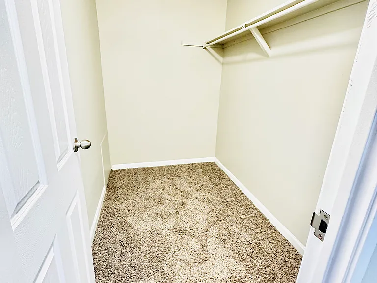 Experience the luxury of ample storage with this bright and spacious walk-in closet. Experience the luxury of ample storage with this bright and spacious walk-in closet.