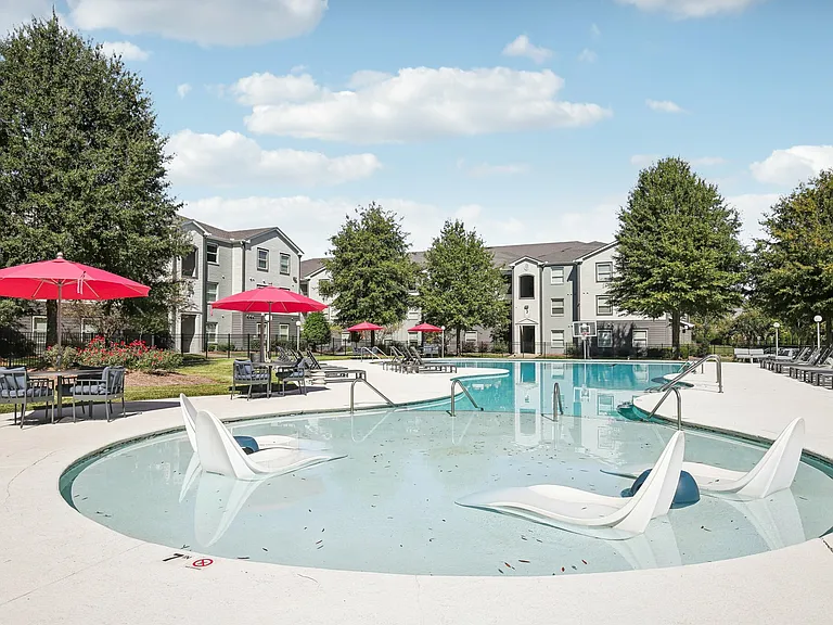 Relax by the resort-style main pool with comfortable lounge chairs and a spacious sunbathing area at The Preserve Murfreesboro.
