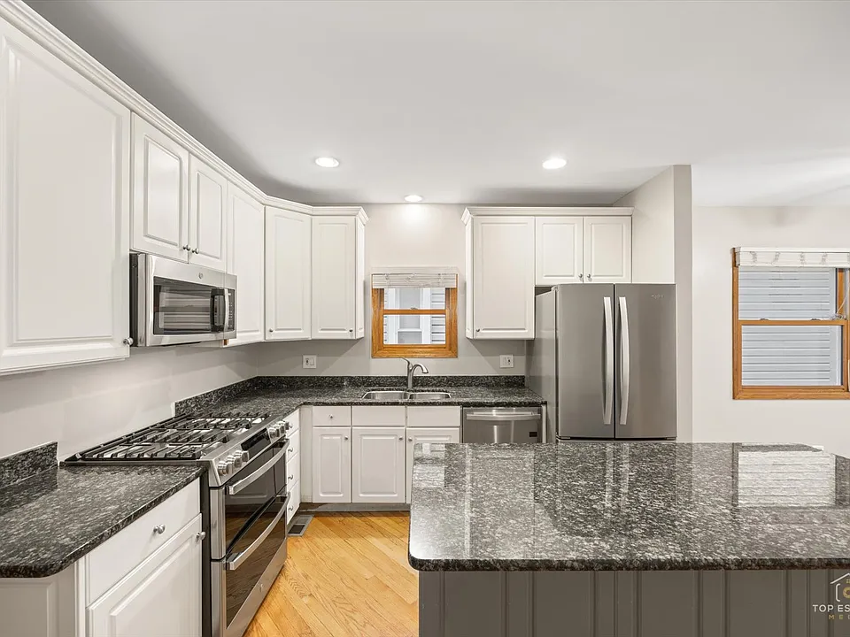 Updated kitchen and $2500 range and $1500 refrigerator/freezer, Moen pull-out kitchen faucet, garbage disposal