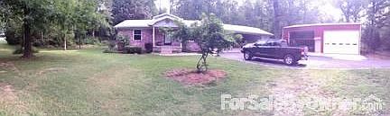 Front panorama
						:
						3 car carport with wrap around storage
2 story 4 bay garage with shop area