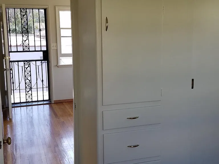 View from Bedroom outward.
Can see built in drawers.