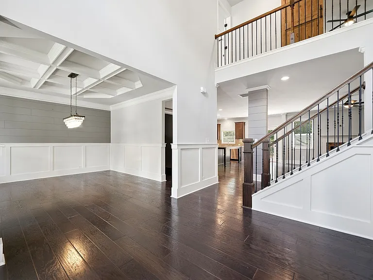 2 story open foyer with views into dining room & family room