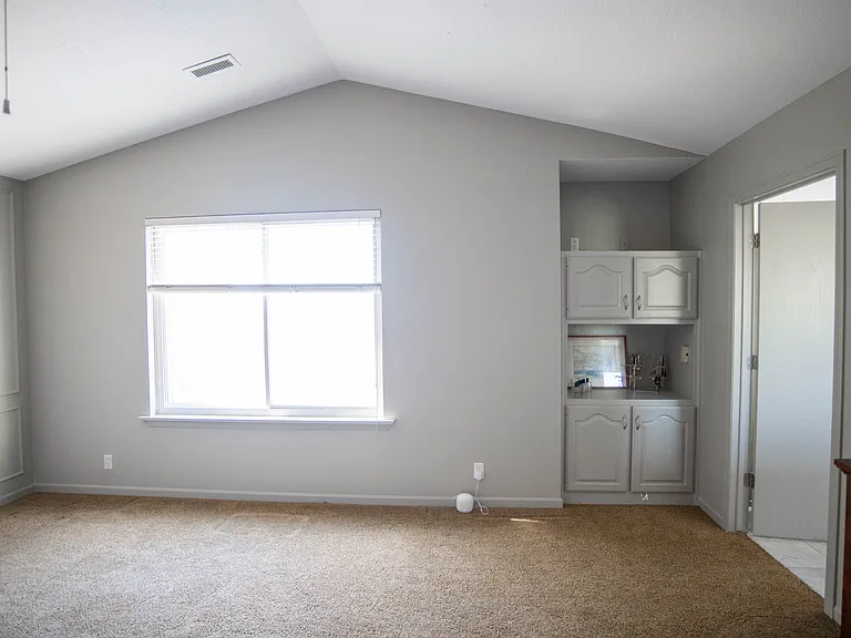 spacious master bedroom with new paint, new box trim, and built ins