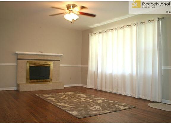 Refinished hardwood floors, refaced fireplace, new paint.